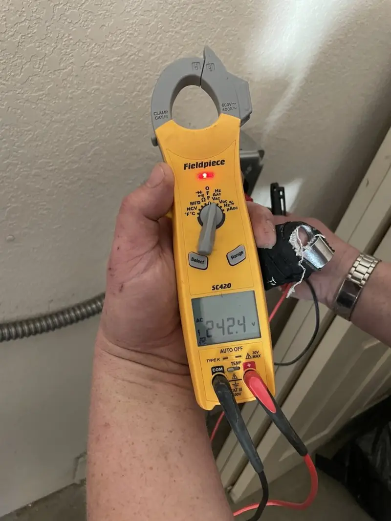 Voltage testing with clamp meter during Recessed Lighting Installation in Edinburgh